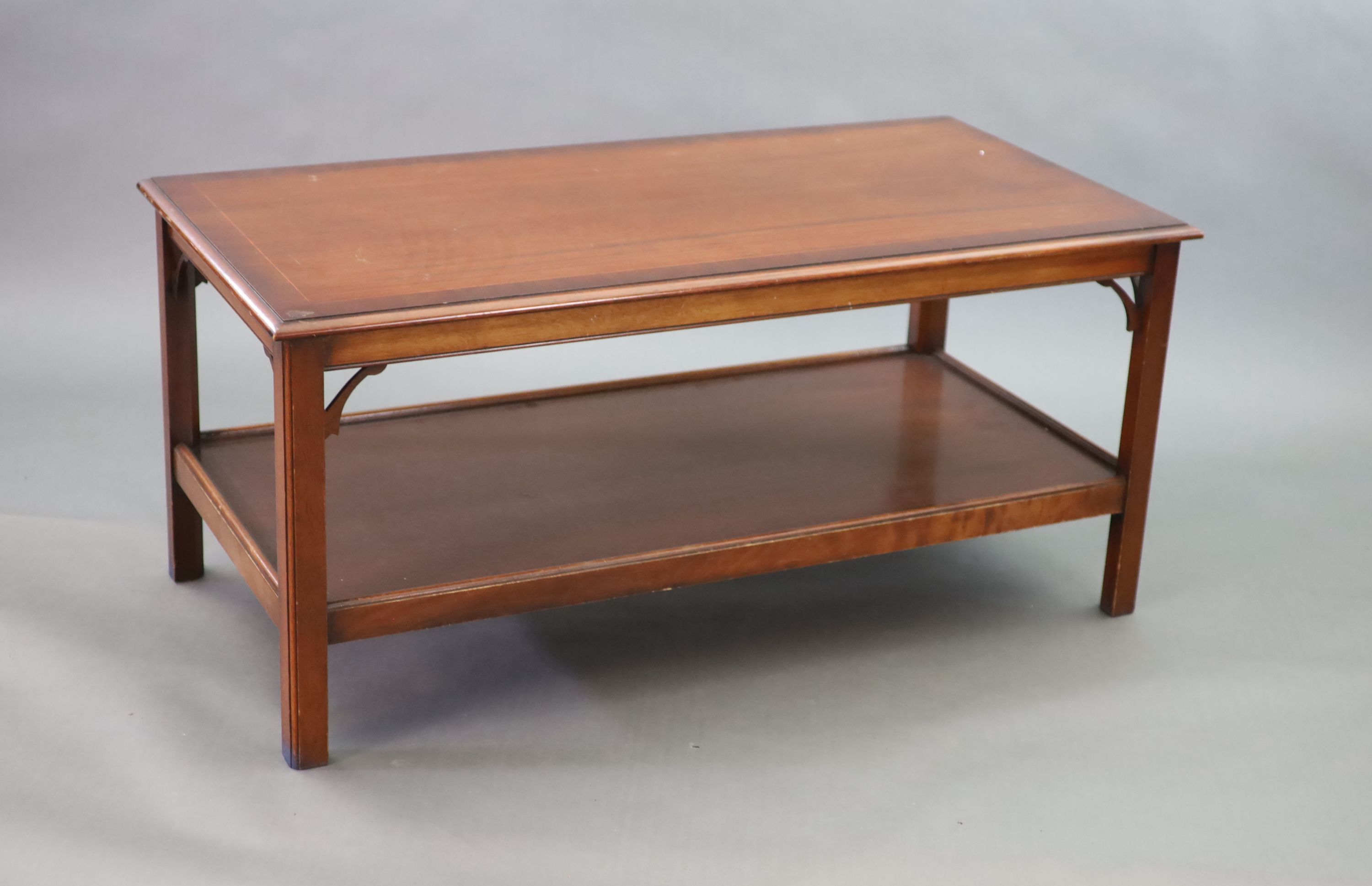 A mahogany two tier coffee table, 122 x 62cm width 122cm depth 62cm height 56cm